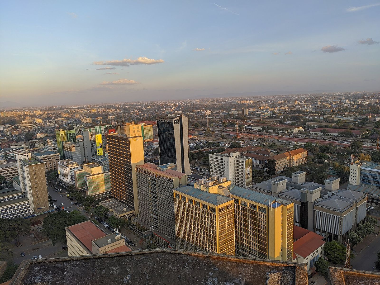 Aerial view over the Nairobi skyline from the KICC rooftop at golden hour